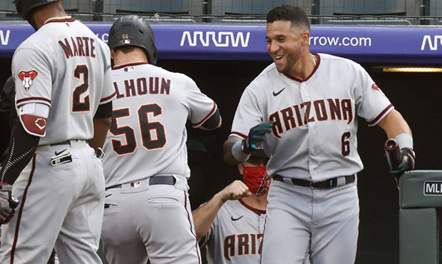 Diamondbacks' Kole Calhoun hit into double play after running error