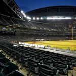 The Colorado Rockies and the Arizona Diamondbacks compete during the second inning of a baseball game, Monday, Aug. 24, 2020, in Phoenix. (AP Photo/Matt York)