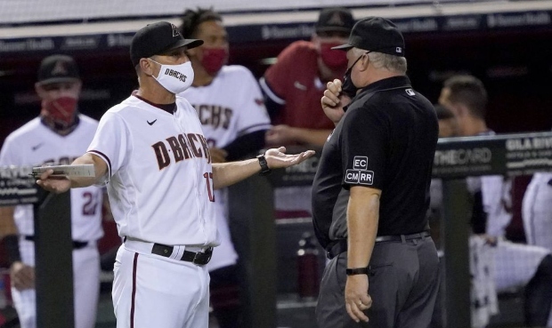 Arizona Diamondbacks manager Torey Lovullo argues with the umpire after a balk call was overturned ...