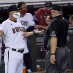 Arizona Diamondbacks manager Torey Lovullo argues with the umpire after a balk call was overturned during the fifth inning of a baseball game against the Colorado Rockies, Monday, Aug. 24, 2020, in Phoenix. (AP Photo/Matt York)
