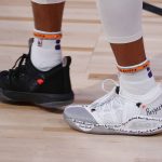 The shoes of Phoenix Suns' Jevon Carter are seen during the first half of an NBA basketball game against the Indiana Pacers'  Thursday, Aug. 6, 2020, in Lake Buena Vista, Fla. (Kevin C. Cox/Pool Photo via AP)