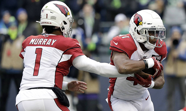 Arizona Cardinals quarterback Kyler Murray (1) hands off to running back Kenyan Drake, right, for a...