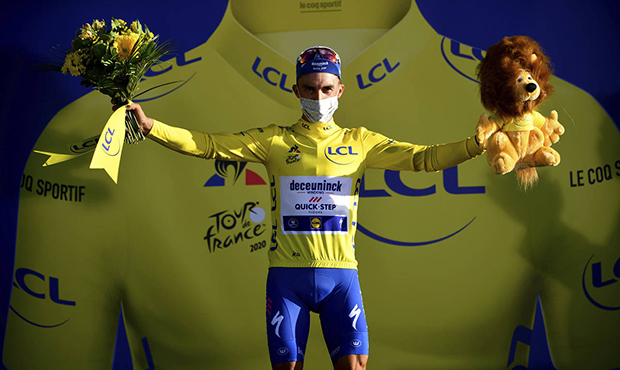 France's Julian Alaphilippe, wearing the overall leader's yellow jersey celebrates on podium after ...