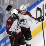 Colorado Avalanche's Pierre-Edouard Bellemare (41) and Matt Nieto (83) celebrate a goal during first-period NHL Western Conference Stanley Cup playoff hockey game action against the Arizona Coyotes in Edmonton, Alberta, Monday, Aug. 17, 2020. (Jason Franson/The Canadian Press via AP)