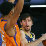 Indiana Pacers' T.J. McConnell , right, is defended by Phoenix Suns' Cameron Payne, left, during the first half of an NBA basketball game Thursday, Aug. 6, 2020, in Lake Buena Vista, Fla. (Kevin C. Cox/Pool Photo via AP)