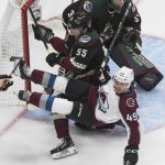 Colorado Avalanche's Samuel Girard (49) is checked by Arizona Coyotes' Jason Demers (55) as goalie Darcy Kuemper (35) looks for the shot during the first period in Game 4 of an NHL hockey first-round playoff series in Edmonton, Alberta, Monday, Aug. 17, 2020. (Jason Franson/The Canadian Press via AP)