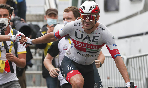 Alexander Kristoff of Norway celebrates as he crosses the finish line to win the first stage of the...