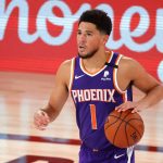Phoenix Suns' Devin Booker dribbles against the Los Angeles Clippers during an NBA basketball game Tuesday, Aug. 4, 2020, in Lake Buena Vista, Fla. (Kevin C. Cox/Pool Photo via AP)