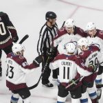 Colorado Avalanche players celebrate a goal as Arizona Coyotes' Michael Grabner (40) skates past during the third period in Game 4 of an NHL hockey first-round playoff series, Monday, Aug. 17, 2020, in Edmonton, Alberta. (Jason Franson/The Canadian Press via AP)