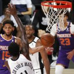 Phoenix Suns' Cameron Payne (15) looks to pass around Los Angeles Clippers' JaMychal Green (4) during an NBA basketball game Tuesday, Aug. 4, 2020, in Lake Buena Vista, Fla. (Kevin C. Cox/Pool Photo via AP)