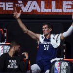 Dallas Mavericks center Boban Marjanovic (51) reacts on the bench during the first half of an NBA basketball game against the Phoenix Suns, Sunday, Aug. 2, 2020, in Lake Buena Vista, Fla. (AP Photo/Ashley Landis, Pool)