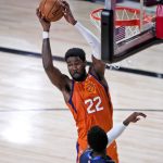 Phoenix Suns' Deandre Ayton (22) grabs the ball during the first half of an NBA basketball game against the Dallas Mavericks Thursday, Aug. 13, 2020 in Lake Buena Vista, Fla. (AP Photo/Ashley Landis, Pool)