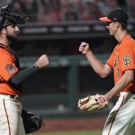 San Francisco Giants pitcher Tyler Rogers, right, is congratulated by catcher Joey Bart after a 6-2 victory against the Arizona Diamondbacks in a baseball game in San Francisco, Friday, Aug. 21, 2020. (AP Photo/Tony Avelar)