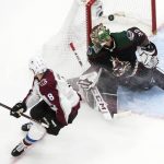 Colorado Avalanche's Cale Makar (8) scores against Arizona Coyotes goalie Antti Raanta (32) during third-period NHL Western Conference Stanley Cup playoff hockey game action in Edmonton, Alberta, Monday, Aug. 17, 2020. (Jason Franson/The Canadian Press via AP)
