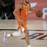 Phoenix Suns' Devin Booker dribbles the ball against the Indiana Pacers during the first half of an NBA basketball game Thursday, Aug. 6, 2020, in Lake Buena Vista, Fla. (Kevin C. Cox/Pool Photo via AP)