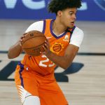 Phoenix Suns' Cameron Johnson passes the ball against the Indiana Pacers during the first half of an NBA basketball game Thursday, Aug. 6, 2020, in Lake Buena Vista, Fla. (Kevin C. Cox/Pool Photo via AP)
