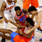 Oklahoma City Thunder's Hamidou Diallo (6) and Steven Adams (27) fight for the ball against Phoenix Suns' Jevon Carter (4) and Dario Saric (20) during the second quarter of an NBA basketball game Monday, Aug. 10, 2020, in Lake Buena Vista, Fla. (Mike Ehrmann/Pool Photo via AP)