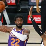Los Angeles Clippers' Marcus Morris Sr., right, defends Phoenix Suns' Deandre Ayton (22) during an NBA basketball game Tuesday, Aug. 4, 2020, in Lake Buena Vista, Fla. (Kevin C. Cox/Pool Photo via AP)