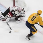 Nashville Predators' Kyle Turris (8) is stopped by Arizona Coyotes goalie Darcy Kuemper (35) during second-period NHL hockey Stanley Cup qualifying round game action in Edmonton, Alberta, Sunday, Aug. 2, 2020. (Jason Franson/The Canadian Press via AP)