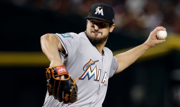 Miami Marlins pitcher Caleb Smith throws in the first inning during a baseball game against the Ari...