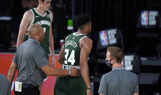 Milwaukee Bucks' Giannis Antetokounmpo (34) heads to the locker room after being ejected during the...