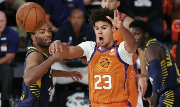 Phoenix Suns' Cameron Johnson (23) passes the ball against the Indiana Pacers during the first half...