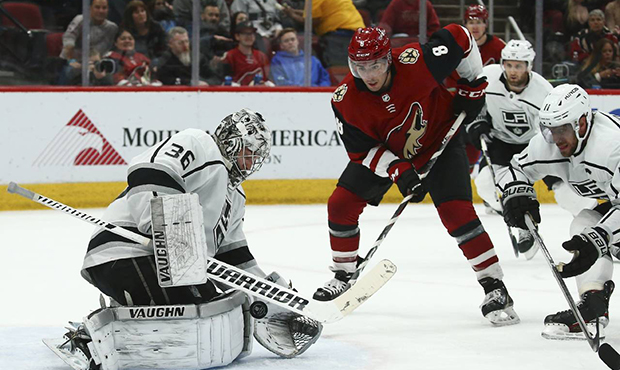 Los Angeles Kings goaltender Jack Campbell (36) makes a save on a shot by Arizona Coyotes center Ni...