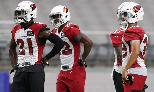Cornerback Patrick Peterson #21 (L) of the Arizona Cardinals stands with teammates during a NFL tea...