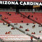 Fans watch during the first half of an NFL football game between the Detroit Lions and the Arizona Cardinals, Sunday, Sept. 27, 2020, in Glendale, Ariz. (AP Photo/Rick Scuteri)