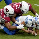 Detroit Lions quarterback Matthew Stafford (9) is sacked by Arizona Cardinals outside linebacker Devon Kennard (42) and defensive tackle Corey Peters (98) during the first half of an NFL football game, Sunday, Sept. 27, 2020, in Glendale, Ariz. (AP Photo/Ross D. Franklin)