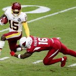 Washington Football Team Steven Sims (15) tries to elude Arizona Cardinals Trent Sherfield (16) on a kick off return during the first half of an NFL football game, Sunday, Sept. 20, 2020, in Glendale, Ariz. (AP Photo/Darryl Webb)