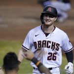 Arizona Diamondbacks' Pavin Smith (26) smiles after his home run against the Colorado Rockies during the fifth inning of the second game of a baseball doubleheader Friday, Sept. 25, 2020, in Phoenix. (AP Photo/Ross D. Franklin)