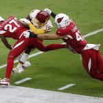 Arizona Cardinals cornerback Kevin Peterson (27) hits Washington Football Team wide receiver Steven Sims (15) during the first half of an NFL football game, Sunday, Sept. 20, 2020, in Glendale, Ariz. (AP Photo/Darryl Webb)