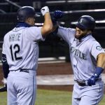 
              Seattle Mariners' Jose Marmolejos, right, celebrates his two-run home run against the Arizona Diamondbacks with Evan White during the fifth inning of a baseball game Saturday, Sept. 12, 2020, in Phoenix. (AP Photo/Ross D. Franklin)
            