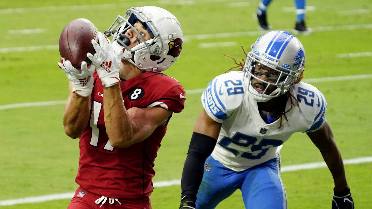 Arizona Cardinals wide receiver Andy Isabella pulls in a touchdown pass as Detroit Lions cornerback...