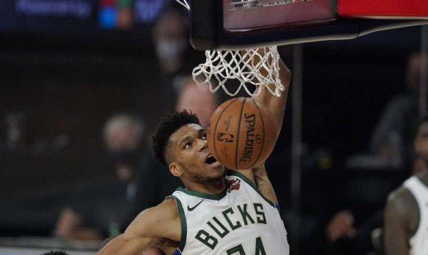 Milwaukee Bucks' Giannis Antetokounmpo (34) dunks in the second half of an NBA conference semifinal...