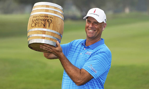 Stewart Cink lifts up his trophy on the 18th green of the Silverado Resort North Course after winni...