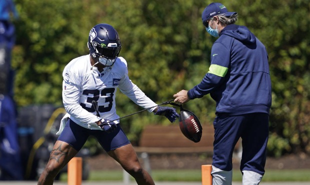 Seattle Seahawks safety Jamal Adams works with a coach during NFL football training camp, Friday, A...
