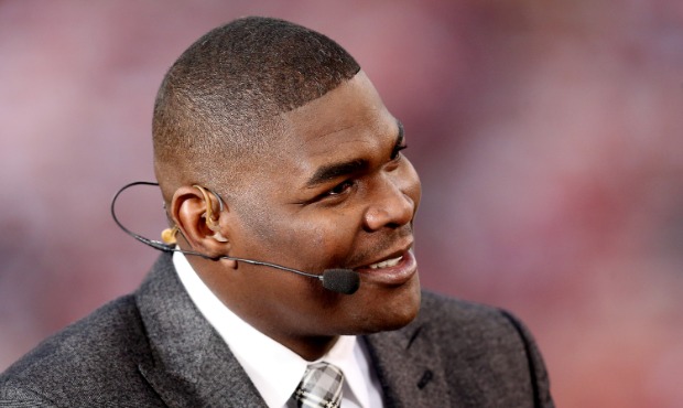 ESPN personality Keyshawn Johnson looks on before the last regular season game played at Candlestic...