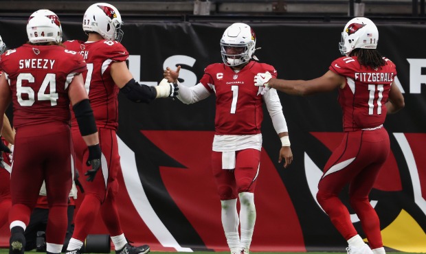 Quarterback Kyler Murray #1 of the Arizona Cardinals is congratulated by Larry Fitzgerald #11 and J...
