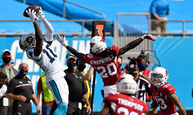 Curtis Samuel #10 of the Carolina Panthers makes a leaping catch over Dre Kirkpatrick #20 of the Ar...