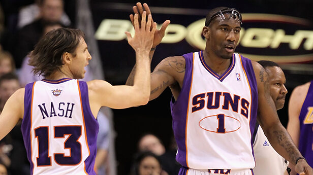 Amar'e Stoudemire #1 and Steve Nash #13 of the Phoenix Suns high-five during the NBA game against t...