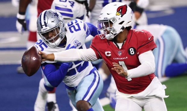 Kyler Murray #1 of the Arizona Cardinals runs for a touchdown against Xavier Woods #25 of the Dalla...