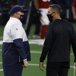 Dallas Cowboys head coach Mike McCarthy, left, and Arizona Cardinals head coach Kliff Kingsbury, right, greet each other on the field during warmups before an NFL football game in Arlington, Texas, Monday, Oct. 19, 2020. (AP Photo/Ron Jenkins)