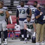 Seattle Seahawks tight end Will Dissly (89) kneels during the national anthem prior to an NFL football game against the Arizona Cardinals, Sunday, Oct. 25, 2020, in Glendale, Ariz. (AP Photo/Ross D. Franklin)