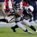 Seattle Seahawks wide receiver Tyler Lockett is tackled by Arizona Cardinals cornerback Dre Kirkpatrick, right during the first half of an NFL football game, Sunday, Oct. 25, 2020, in Glendale, Ariz. (AP Photo/Ross D. Franklin)