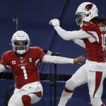 Arizona Cardinals' Kyler Murray (1) and DeAndre Hopkins (10) celebrate a touchdown scored on a carry by Murray in the second half of an NFL football game against the Dallas Cowboys in Arlington, Texas, Monday, Oct. 19, 2020. (AP Photo/Ron Jenkins)