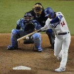 Los Angeles Dodgers' Enrique Hernandez hits a RBI-single against the Tampa Bay Rays during the fifth inning in Game 1 of the baseball World Series Tuesday, Oct. 20, 2020, in Arlington, Texas. (AP Photo/Sue Ogrocki)