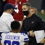 Dallas Cowboys head coach Mike McCarthy, center left, and Arizona Cardinals head coach Kliff Kingsbury, center right, greet each other after their NFL football game in Arlington, Texas, Monday, Oct. 19, 2020. (AP Photo/Ron Jenkins)