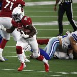 Arizona Cardinals running back Chase Edmonds (29) breaks through the line for a short gain in the second half of an NFL football game against the Dallas Cowboys in Arlington, Texas, Monday, Oct. 19, 2020. (AP Photo/Michael Ainsworth)